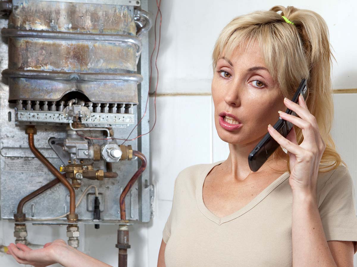 a woman complaining about her rusty water heater on the phone